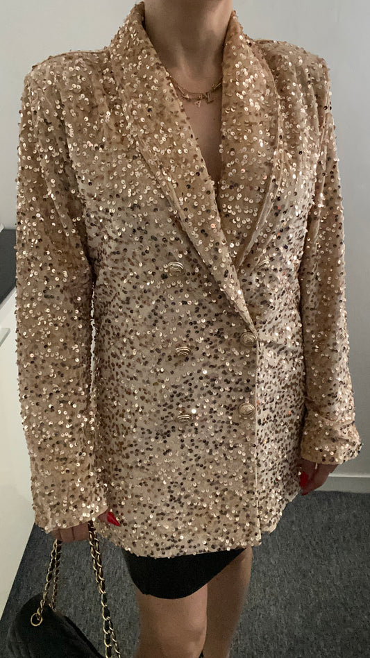 Blazer à paillettes élégant pour femme, veste tendance et brillante, idéale pour un look chic et festif. Parfait pour les soirées et événements spéciaux.